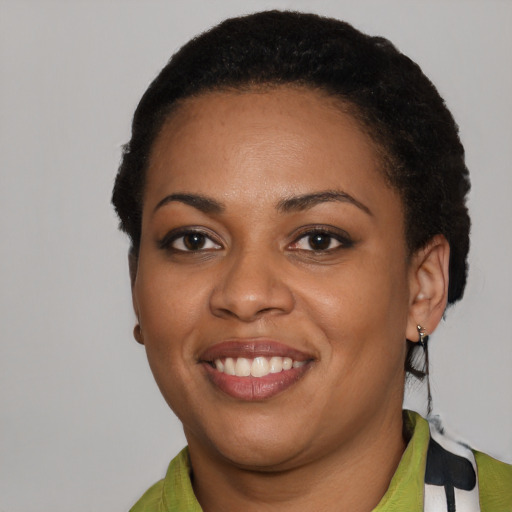 Joyful latino young-adult female with short  black hair and brown eyes