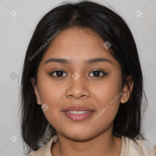 Joyful latino young-adult female with medium  brown hair and brown eyes