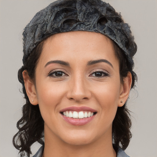 Joyful latino young-adult female with long  black hair and brown eyes