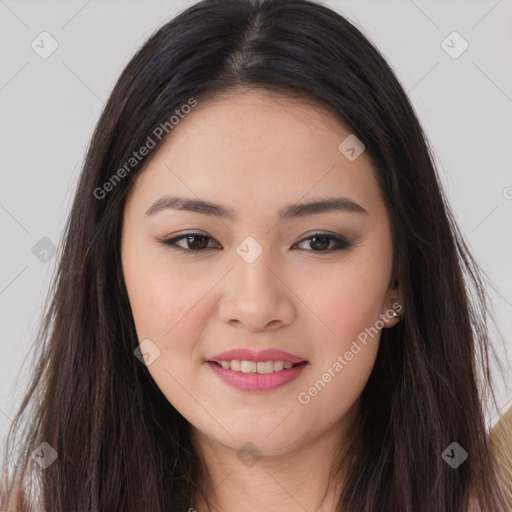 Joyful asian young-adult female with long  brown hair and brown eyes