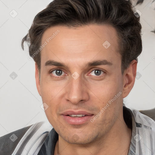 Joyful white adult male with short  brown hair and brown eyes