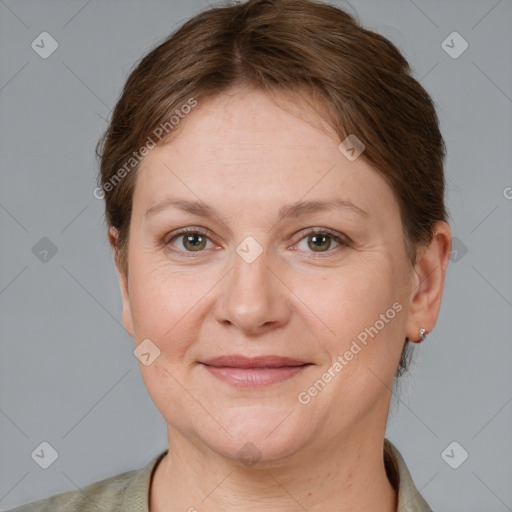 Joyful white adult female with short  brown hair and grey eyes