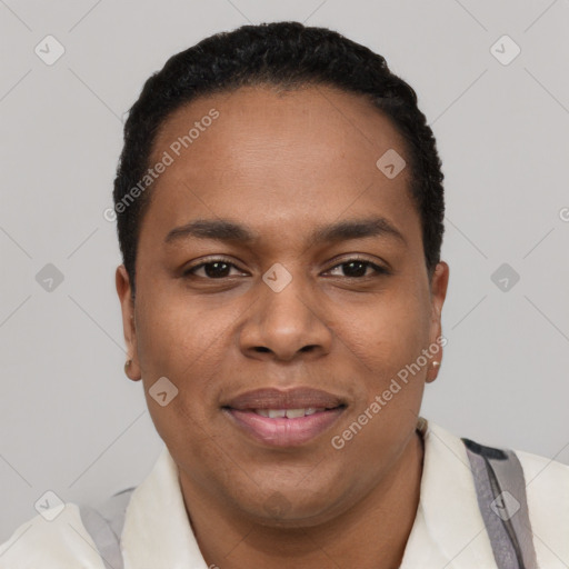 Joyful black young-adult male with short  black hair and brown eyes