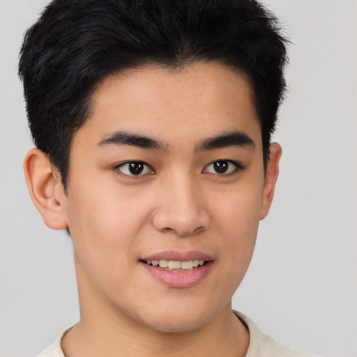Joyful asian young-adult male with short  brown hair and brown eyes