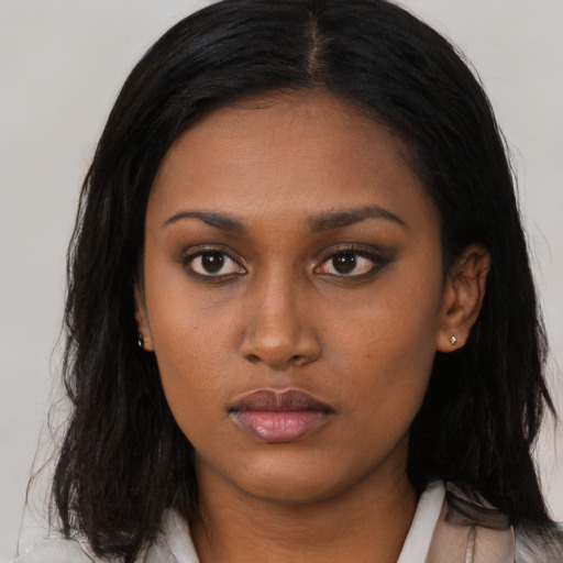 Neutral black young-adult female with long  black hair and brown eyes