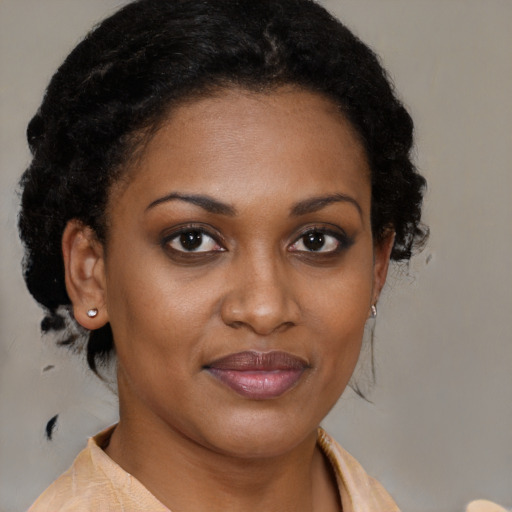 Joyful black young-adult female with medium  brown hair and brown eyes