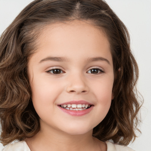 Joyful white child female with medium  brown hair and brown eyes