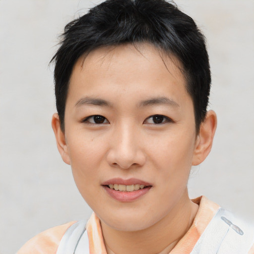 Joyful asian young-adult female with short  brown hair and brown eyes