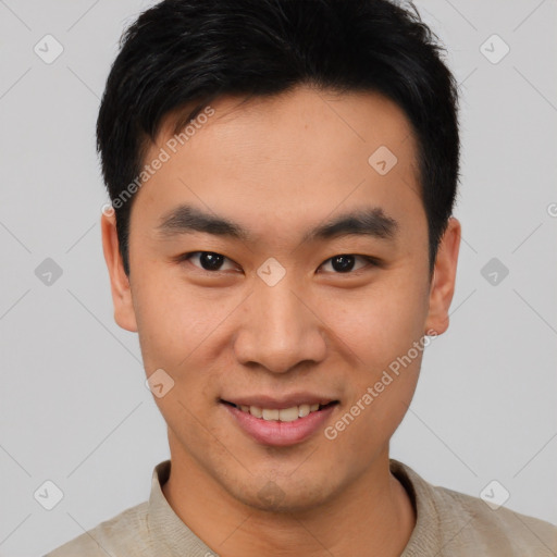 Joyful asian young-adult male with short  black hair and brown eyes