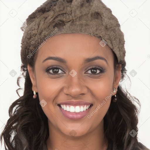 Joyful black young-adult female with long  brown hair and brown eyes