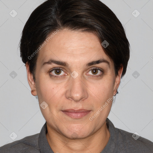 Joyful white adult female with short  brown hair and brown eyes