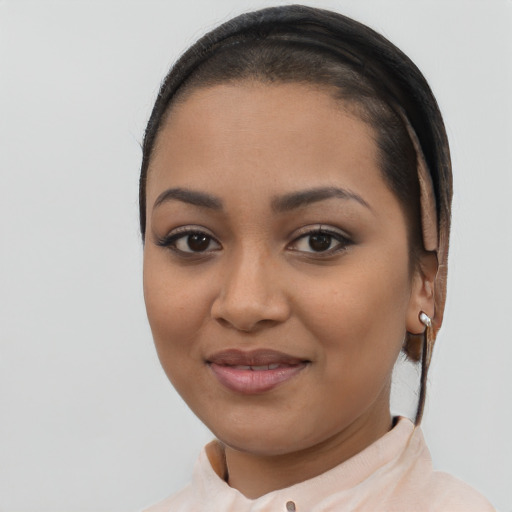 Joyful latino young-adult female with short  brown hair and brown eyes