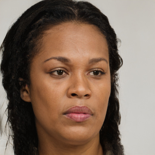 Neutral black young-adult female with long  brown hair and brown eyes