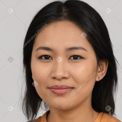 Joyful asian young-adult female with long  brown hair and brown eyes