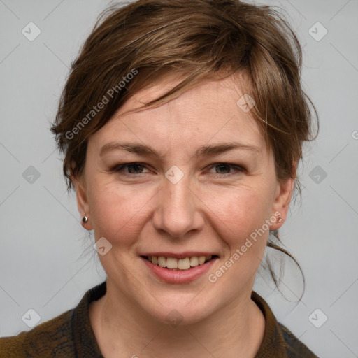 Joyful white adult female with medium  brown hair and blue eyes