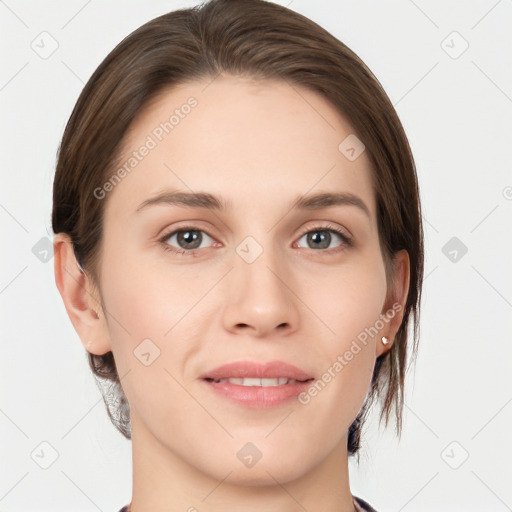 Joyful white young-adult female with medium  brown hair and grey eyes