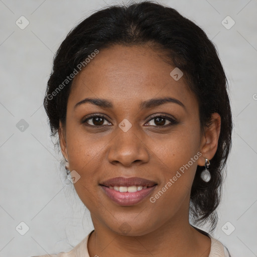 Joyful black young-adult female with medium  brown hair and brown eyes