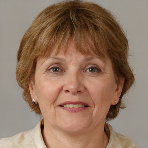 Joyful white middle-aged female with medium  brown hair and brown eyes