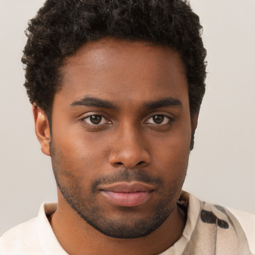 Neutral black young-adult male with short  brown hair and brown eyes