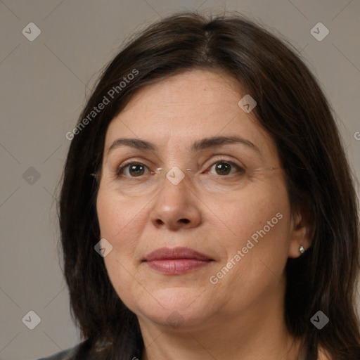 Joyful white adult female with medium  brown hair and brown eyes