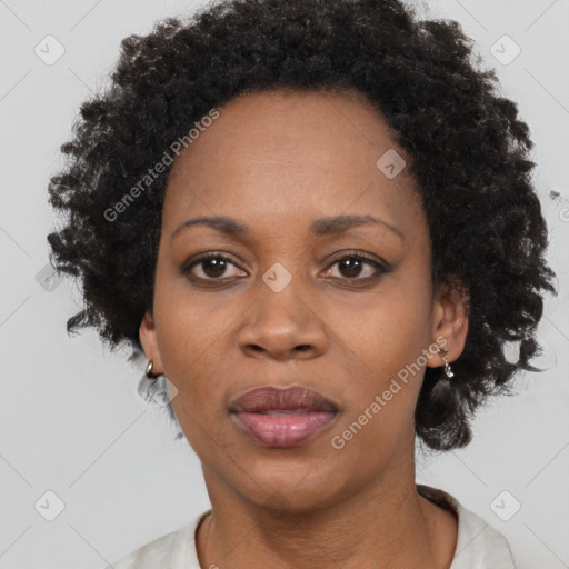 Joyful black adult female with short  black hair and brown eyes