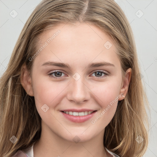 Joyful white young-adult female with long  brown hair and grey eyes