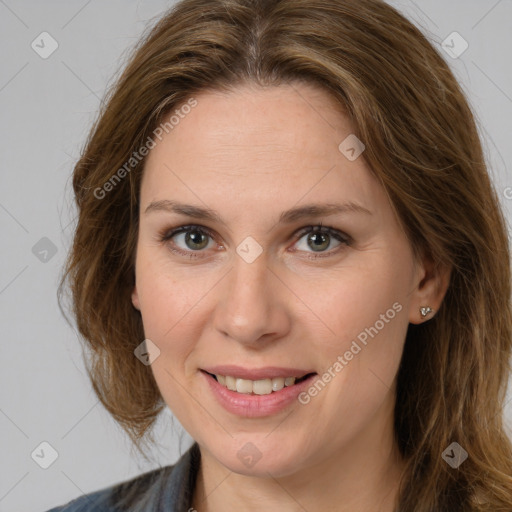 Joyful white adult female with long  brown hair and brown eyes