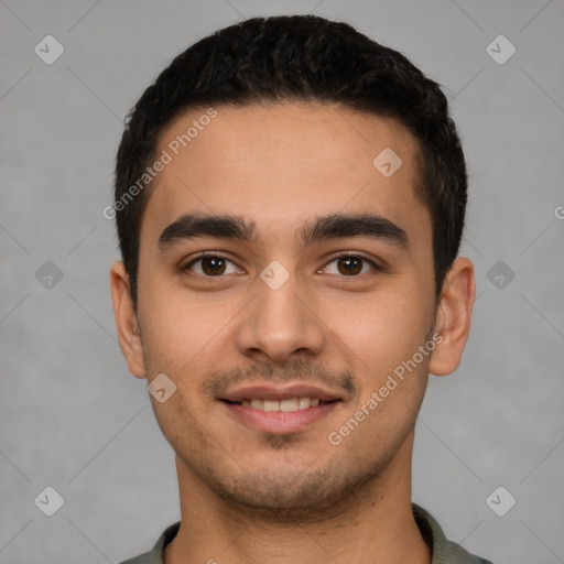 Joyful white young-adult male with short  black hair and brown eyes