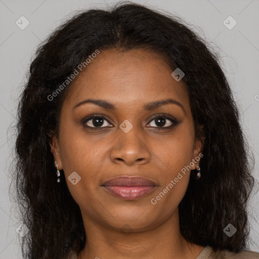 Joyful black young-adult female with long  brown hair and brown eyes