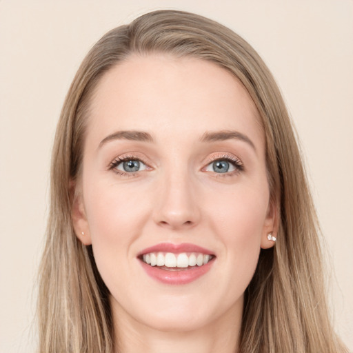 Joyful white young-adult female with long  brown hair and grey eyes