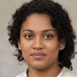 Joyful black young-adult female with medium  brown hair and brown eyes