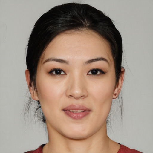 Joyful white young-adult female with medium  black hair and brown eyes