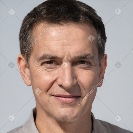 Joyful white middle-aged male with short  brown hair and brown eyes