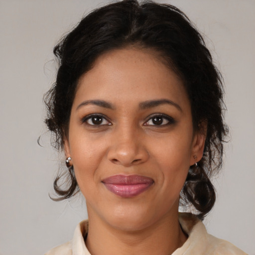 Joyful black young-adult female with medium  brown hair and brown eyes