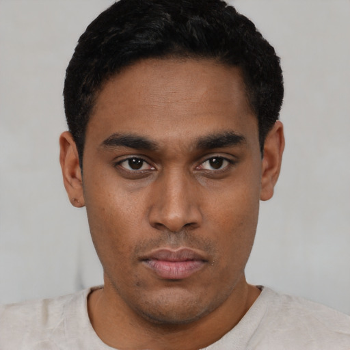 Neutral latino young-adult male with short  black hair and brown eyes