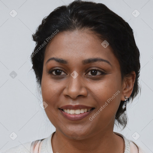 Joyful black young-adult female with medium  brown hair and brown eyes