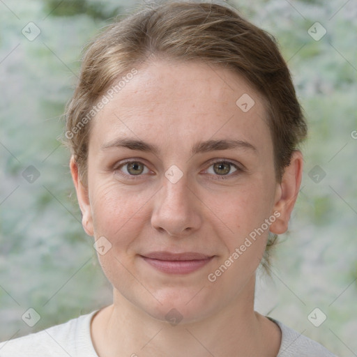 Joyful white young-adult female with short  brown hair and grey eyes