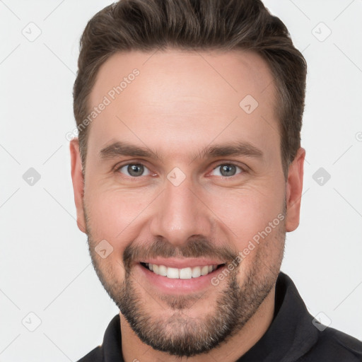 Joyful white young-adult male with short  brown hair and brown eyes