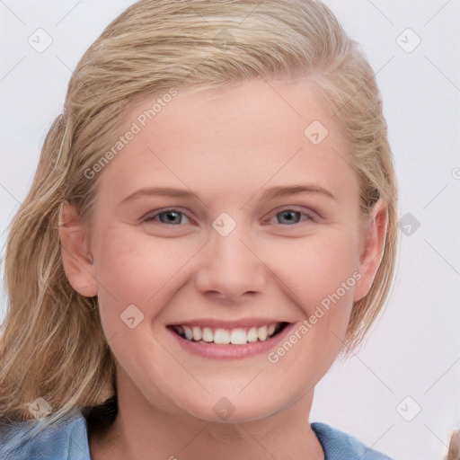 Joyful white young-adult female with medium  brown hair and blue eyes