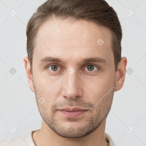 Neutral white young-adult male with short  brown hair and grey eyes