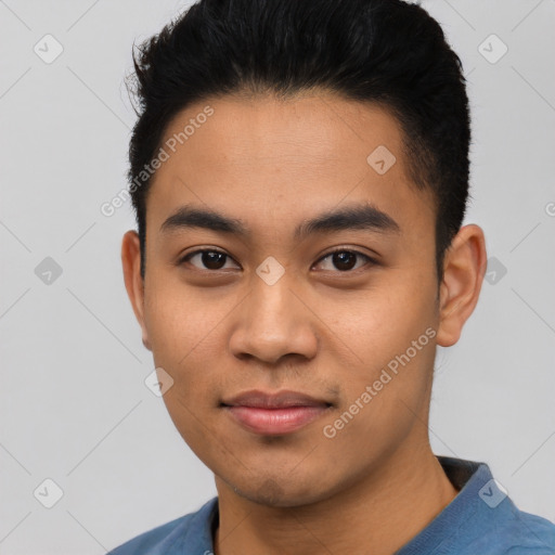 Joyful asian young-adult male with short  black hair and brown eyes