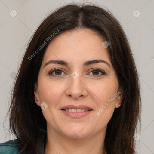 Joyful white adult female with medium  brown hair and brown eyes