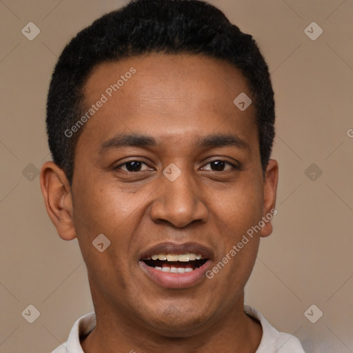 Joyful black young-adult male with short  black hair and brown eyes
