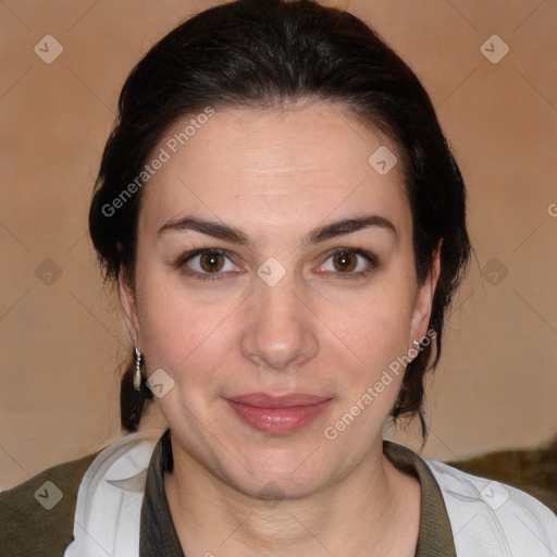 Joyful white adult female with medium  brown hair and brown eyes