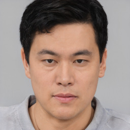 Neutral asian young-adult male with short  brown hair and brown eyes