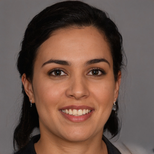 Joyful white young-adult female with medium  brown hair and brown eyes