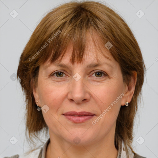 Joyful white adult female with medium  brown hair and grey eyes