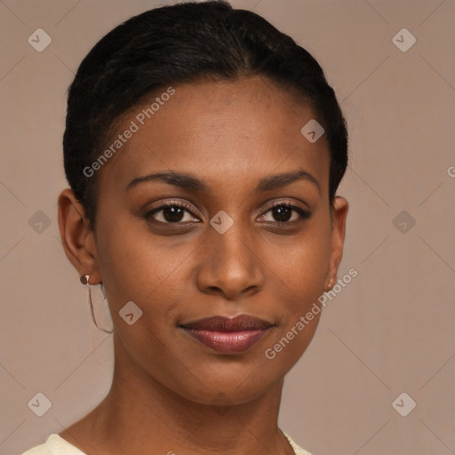Joyful black young-adult female with short  brown hair and brown eyes