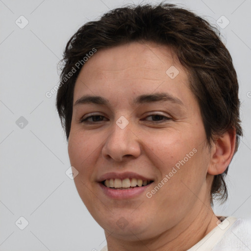 Joyful white adult female with short  brown hair and brown eyes