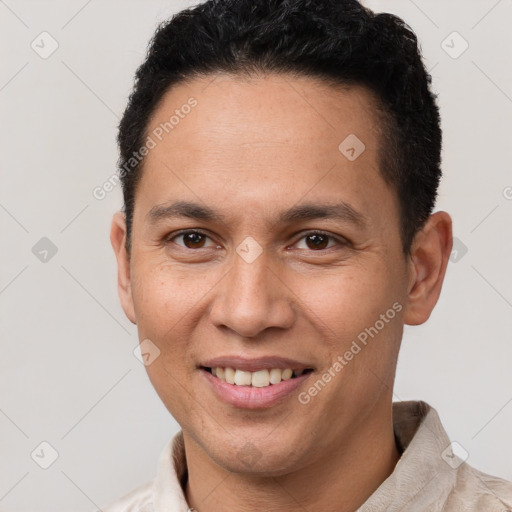 Joyful white adult male with short  brown hair and brown eyes